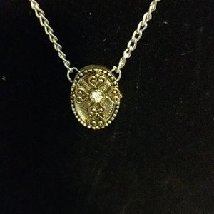 Delicate cross in silver and gold setting 18 inch